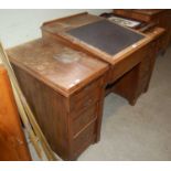 A 19th century oak kneehole writing desk
