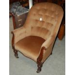 A 19th century mahogany velvet upholstered button down armchair on tapered cylindrical supports with