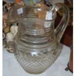An early 19th century diamond cut clear glass jug, 21.5cm