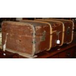 A vintage wood and metal bound cabin trunk