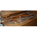 A pair of vintage snow shoes, together with a folding chair cane and two serving trays
