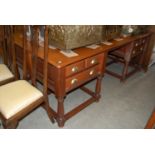 A large stained wood South African centre desk / table with rectangular top over central kneehole on