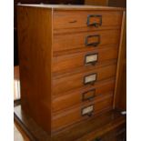 A vintage blondewood table top chest of six drawers