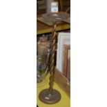 A brass vesta holder stand with twisted column support