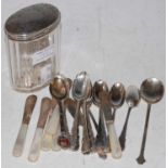 A set of twelve London silver coffee spoons, six Sheffield silver and mother of pearl handled butter
