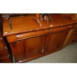 A 20th century mahogany chiffonier with two short drawers over two cupboard doors opening to a