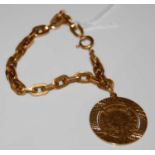 An 18ct gold chain-link bracelet suspending yellow metal mounted gold 'Napolean III Barre Head'