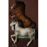 Two Beswick horses comprising a rearing Welsh Cob, and another Beswick figure of a prancing Arab