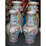 Two pairs of Chinese Canton famille rose pattern vases, 25cm high and 21cm high respectively