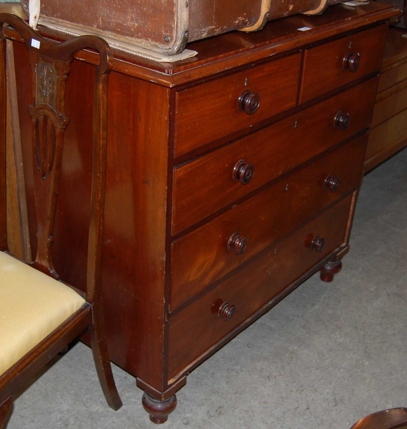 A 19th century mahogany chest of two short over three long drawers on bun feet