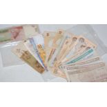 A collection of assorted banknotes of the world to include Bank of Indonesia, Central Bank of