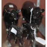 A Beswick Aberdeen Angus black bull, cow and two calves