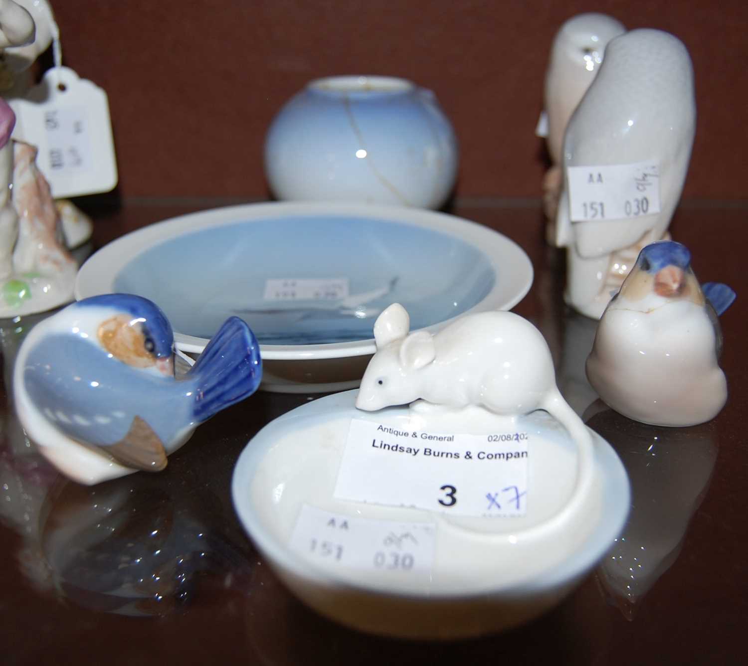 A collection of Royal Copenhagen porcelain to include a pair of owls, two small birds, a dish with