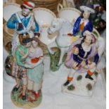 A porcelain figure group to include a Staffordshire figure of Tom King, another similar