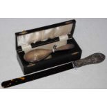 A Birmingham silver mounted faux tortoiseshell page turner, the silver handle with embossed scroll
