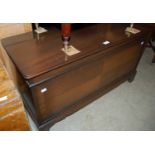 A reproduction mahogany blanket box with hinged top