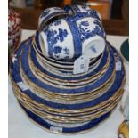 A Royal Doulton Booths Real Old Willow pattern part tea/dinner set comprising cups, saucers, plates,