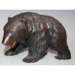 A Black Forest carved wood figure of a bear, 10cm high