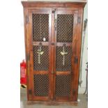 A darkwood food-hutch with two metal grill doors