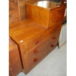An Art Deco walnut shaped chest of drawers with two short over three long graduated drawers