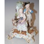 A Meissen porcelain figure group, boy girl and goat, blue cross swords mark, 18cm high