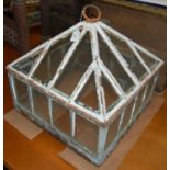 A late 19th / early 20th century cast metal and glass garden cloche frame and cover, 46cm square