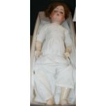 A late 19th / early 20th century German bisque headed doll, the rear of head stamped with makers