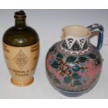 A Royal Doulton Arts and Crafts style jug, with incised decoration of lion, antelope and boar on a