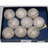 A box containing nine assorted vintage fives balls