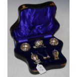 A Birmingham silver cased five-piece Art Nouveau style cruet set