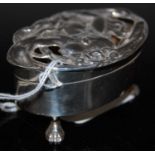 An Edwardian Art Nouveau silver table box, Birmingham 1903, makers mark of 'CSG&Co', oval shaped,