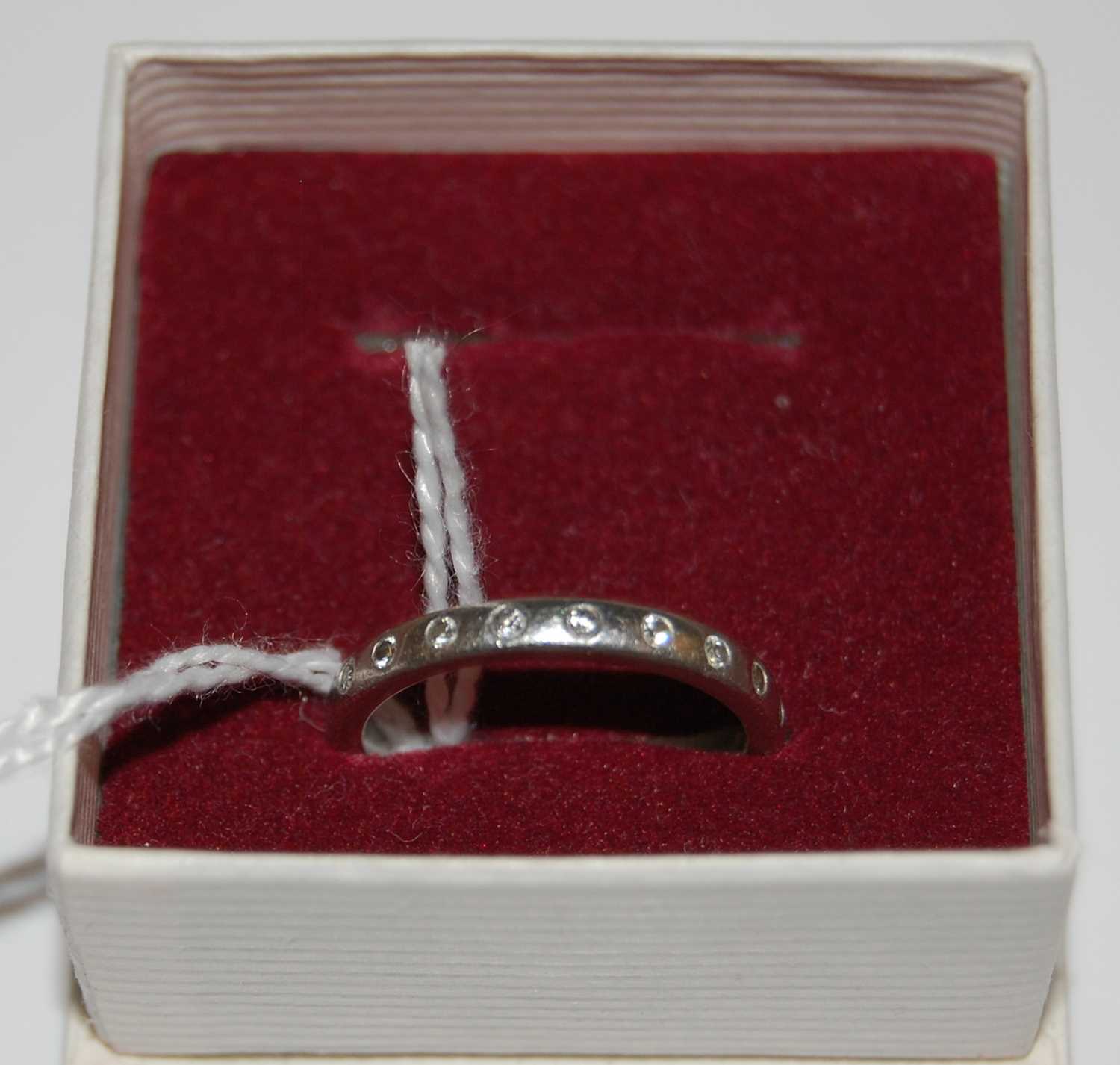 A platinum and diamond ten stone ring, stamped marks '950', ring size 'L', gross weight 4.7 grams - Image 2 of 2