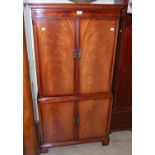 A reproduction mahogany four door side cabinet