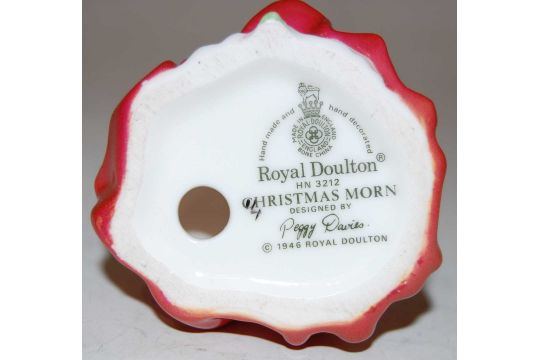 A miniature Royal Doulton figure 'Christmas Morn' designed by Peggy Davies HN3212, 10cm high - Image 2 of 2