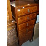 An early 20th century walnut tall six drawer chest