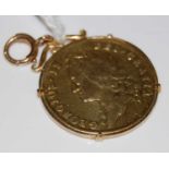 A George II, 1739 gold Guinea in later 9ct gold mount, gross weight 9.4 grams, overall diameter in