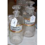 Two apothecary jars, one labelled 'Pulv: dentifrice', the other labelled as 'Tinct: aurant:'