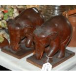 A pair of wooden carved elephant bookends