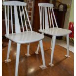 A pair of white painted spindle back kitchen side chairs