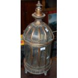 A decorative gilt metal and clear glass dome top lantern