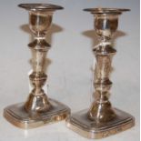 A pair of George V silver candlesticks, Sheffield, 1919, makers mark of 'HE Ltd', with detachable