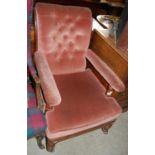 A late 19th century mahogany velvet upholstered club armchair with button back and loose cushion