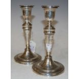 A pair of Sheffield silver candlesticks, makers mark 'I P & Co' with detachable drip pans, in the