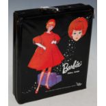 A vintage Barbie doll case, contents to include single Barbie doll, various clothing accessories and