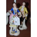 A pair of late 19th/ early 20th century Continental porcelain figure groups, 19th century male