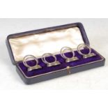 A set of four George V silver place card holders, Chester, 1911,