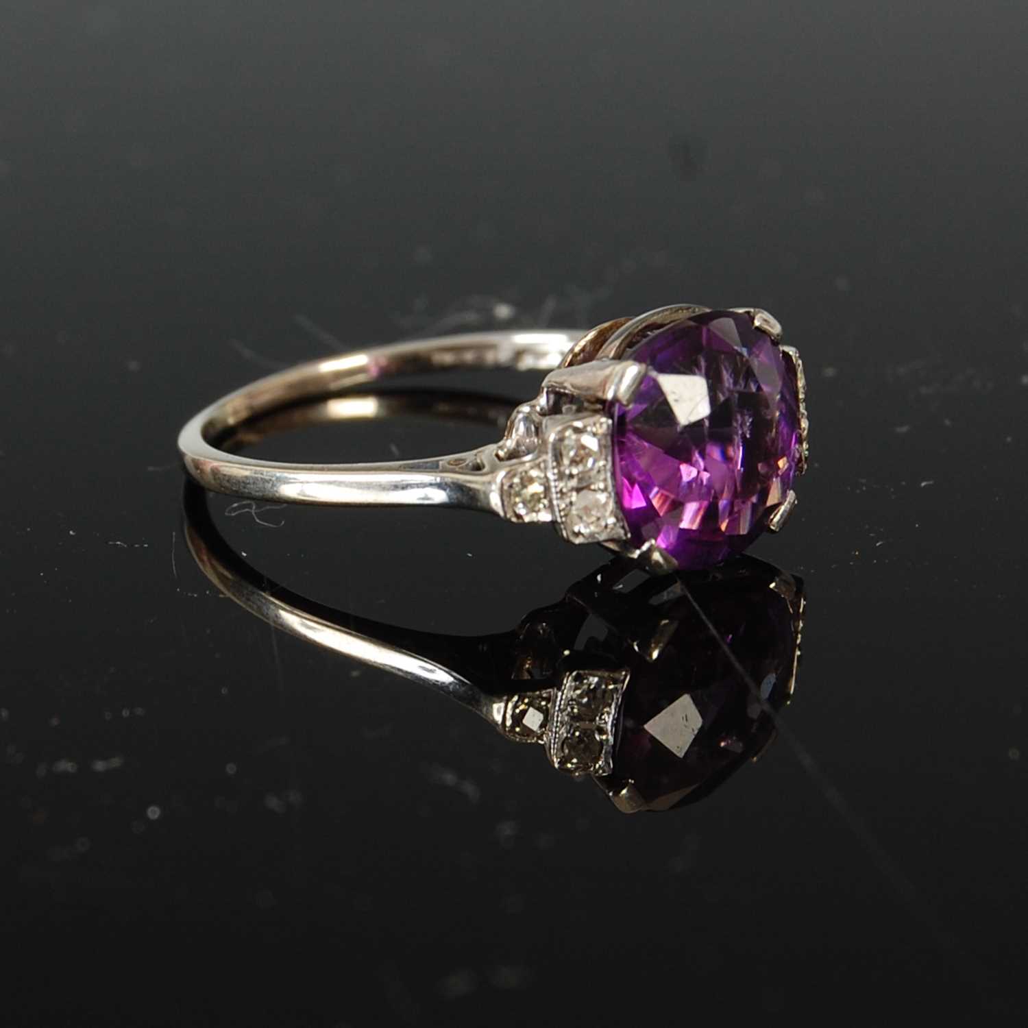 A mid 20th century Art Deco style white metal, amethyst and diamond set cocktail ring, - Image 3 of 6