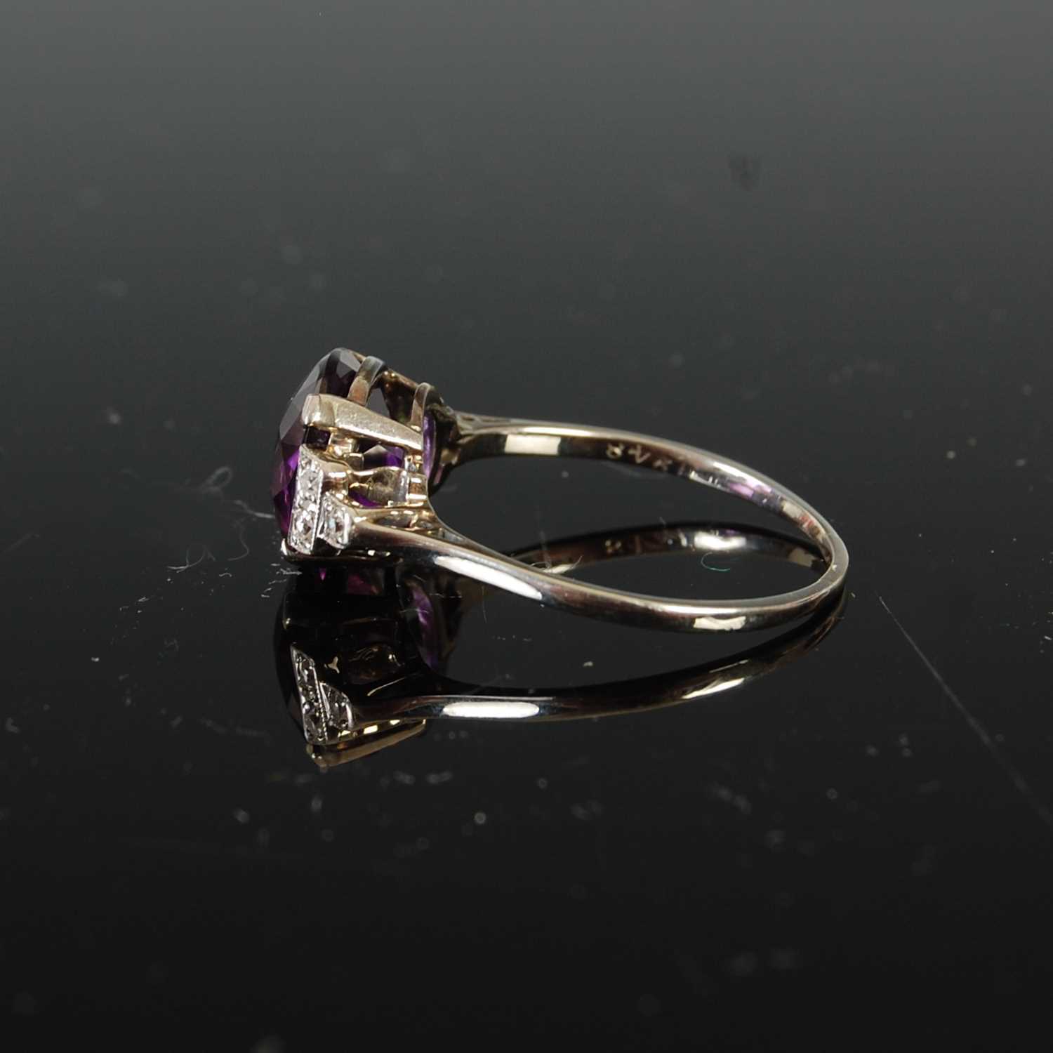 A mid 20th century Art Deco style white metal, amethyst and diamond set cocktail ring, - Image 5 of 6