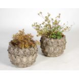 A pair of composite stone garden planters