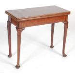 A George III mahogany fold-over concertina action card table,